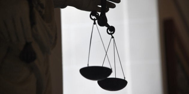 A picture taken on May 19, 2015 at Rennes' courthouse shows a statue of the goddess of Justice balancing the scales. AFP PHOTO / DAMIEN MEYER (Photo credit should read DAMIEN MEYER/AFP/Getty Images)