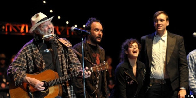 MOUNTAIN VIEW, CA - OCTOBER 22: Musicians Neil Young and Dave Matthews perform with Régine Chassagne and Win Butler of Arcade Fire at the 25th Annual Bridge School Benefit Concert at Shoreline Amphitheatre on October 22, 2011 in Mountain View, California. (Photo by John Shearer/WireImage)