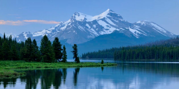 Mt Charlton and Mt Unwin reflected in Maligne Lake at dawn, Jasper National Park, Alberta, Canada