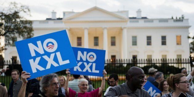 Demonstrators, celebrating US President Barack Obama's blocking of the Keystone XL oil pipeline, rally in front of the White House in Washington, DC on November 6, 2015. US President Barack Obama blocked the Keystone XL oil pipeline that Canada sought to build into the United States, ruling it would harm the fight against climate change. AFP PHOTO/ ANDREW CABALLERO-REYNOLDS (Photo credit should read Andrew Caballero-Reynolds/AFP/Getty Images)