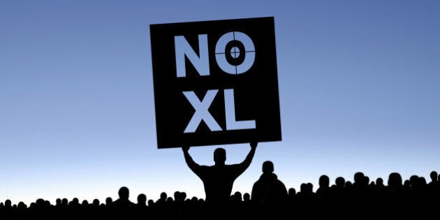 'keystone pipeline protestors in silhouette with man holding 'NO XL' sign, panoramic frame (XXXL)'