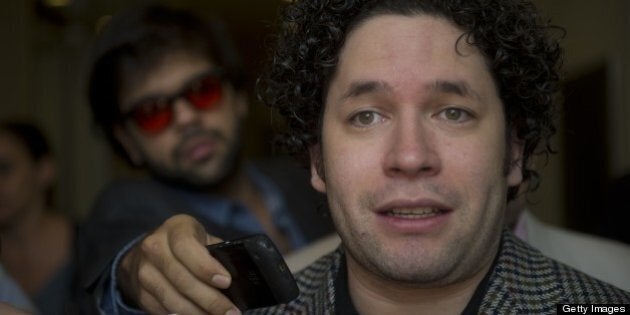 Venezuelan maestro Gustavo Dudamel speaks to reporters in Bogota on April 11, 2013. Dudamel is in Colombia to conduct the Simon Bolivar Symphonic Orchestra in concert tonight. AFP PHOTO /Eitan Abramovich (Photo credit should read EITAN ABRAMOVICH/AFP/Getty Images)