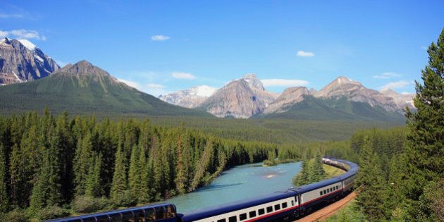 The Rocky Mountaineer tourist passenger train at Morant's Curve on the CPR line along the Bow River near Lake Louise in Banff National Park, Alberta, Canada.