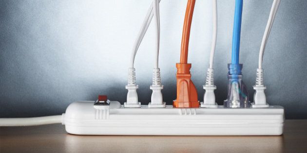 Close up of cords plugged into power strip