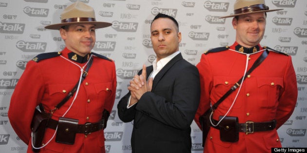 VANCOUVER - MARCH 29: Host of the 2009 Junos, Russell Peters (M) attends the 2009 Juno Awards at General Motors Place on March 29, 2009 in Vancouver, British Columbia, Canada. (Photo by George Pimentel/WireImage)