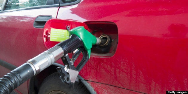 Car filling up at gas station