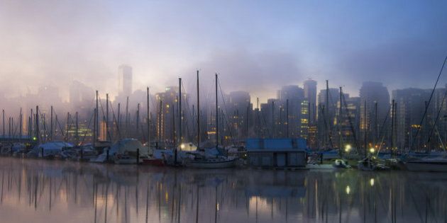 Early morning view over the marina and waterfront and mist rising