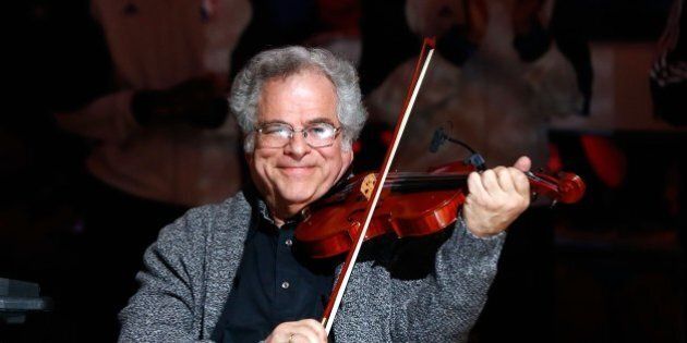 NEW YORK, NY - JANUARY 28: (NEW YORK DAILIES OUT) Violinist Itzhak Perlman performs before the NBA game between the Brooklyn Nets and Orlando Magic at the Barclays Center on January 28 , 2013 in the Brooklyn borough of New York City.The Nets defeated the Magic 97-77. NOTE TO USER: User expressly acknowledges and agrees that, by downloading and/or using this Photograph, user is consenting to the terms and conditions of the Getty Images License Agreement. (Photo by Jim McIsaac/Getty Images)