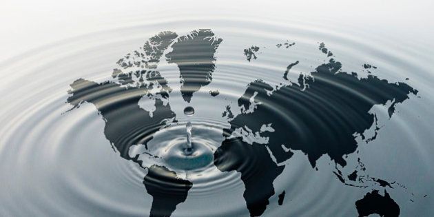 Rippling water over map of globe