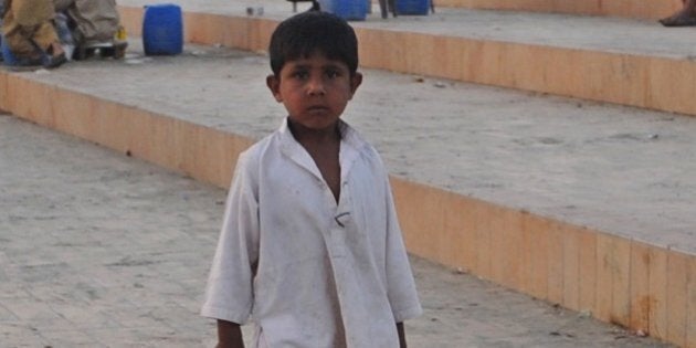 A Pakistani child sells beverages on a beach in Karachi on March 21, 2012 on the eve of the UN World Water Day. More than 2.5 billion people are in need of decent sanitation and nearly one in 10 has yet to gain access to 'improved' drinking water, as defined under the UN's 2015 development goals. AFP PHOTO/Rizwan TABASSUM (Photo credit should read RIZWAN TABASSUM/AFP/Getty Images)