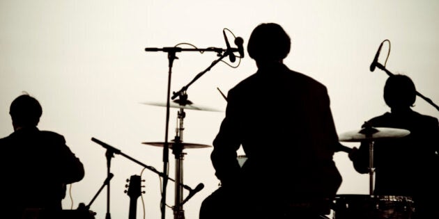 This is a silhouette of a Beatles cover band playing on Pensacola Beach for 'Bands on the Beach'. Of course this was 'Ringo' on the drums.