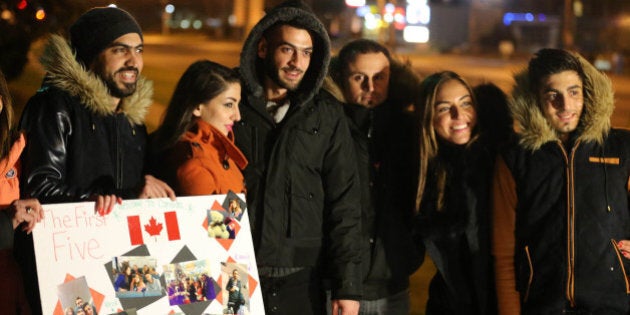 MISSISSAUGA, ON- DECEMBER 11: Christine Youssef, second from right and George Hababeh, third from the right, are excited to reunite with their cousins. Syrian refugees begin to arrive in Canada at a hotel near Pearson International Airport in Mississauga. December 11, 2015. (Steve Russell/Toronto Star via Getty Images)