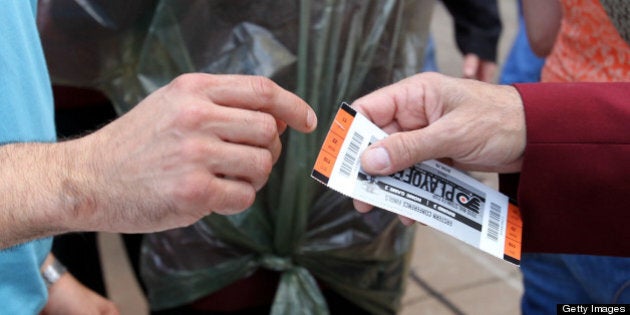 PHILADELPHIA - MAY 24: A ticket taker checks tickets before Game 5 of the Eastern Conference Finals between the Montreal Canadiens and Philadelphia Flyers during the 2010 NHL Stanley Cup Playoffs at Wachovia Center on May 24, 2010 in Philadelphia, Pennsylvania. (Photo by Bruce Bennett/Getty Images)