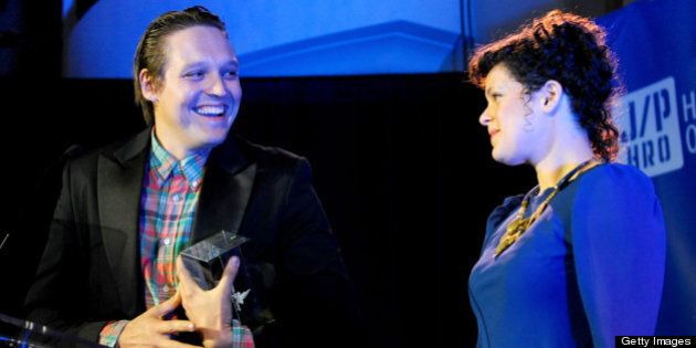 LOS ANGELES, CA - JANUARY 14: Musicians Win Butler(L) and Regine Chassagne of Arcade Fire speak onstage at the Cinema For Peace event benefitting J/P Haitian Relief Organization in Los Angeles held at Montage Hotel on January 14, 2012 in Los Angeles, California. (Photo by Michael Buckner/Getty Images For J/P Haitian Relief Organization and Cinema For Peace)