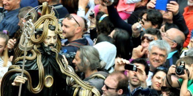 A statue of Saint Domenico covered with live snakes is carried by the faithful during an annual procession in the streets of Cocullo, in the Abruzzo region, on May 1, 2014. AFP PHOTO / TIZIANA FABI (Photo credit should read TIZIANA FABI/AFP/Getty Images)