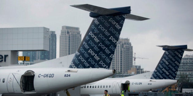 Porter Airlines Inc. aircraft sit parked at Billy Bishop Toronto City Airport in Toronto, Ontario, Canada, on Friday, June 28, 2013. Porter Airlines Inc., the Canadian carrier that now flies only turboprops, plans to add its first jets to start long-haul flights in an expanded challenge to Air Canada and WestJet Airlines Ltd. Photographer: Brent Lewin/Bloomberg via Getty Images