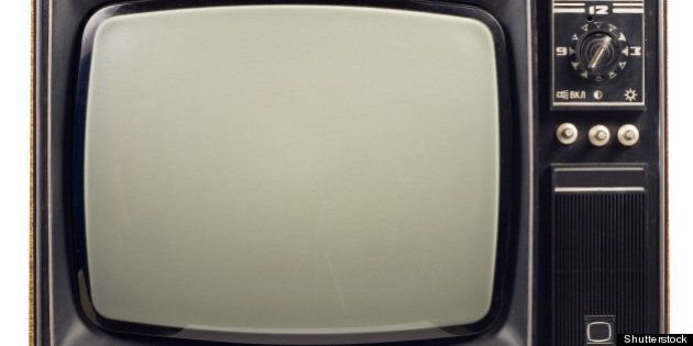 old vintage tv over a white...