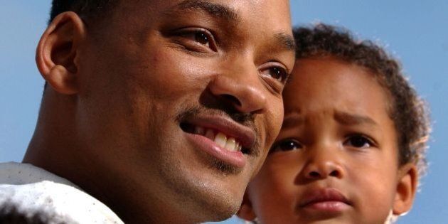 LOS ANGELES, UNITED STATES: US actor Will Smith (L) holds his son Jaden as he arrives at the premiere of new film 'Spider-Man,' in Los Angeles, CA, 29 April 2002. AFP PHOTO/Lucy Nicholson (Photo credit should read LUCY NICHOLSON/AFP/Getty Images)