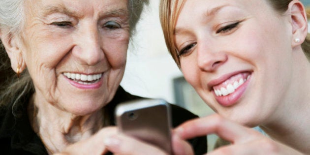 Two happy women and a cellphone