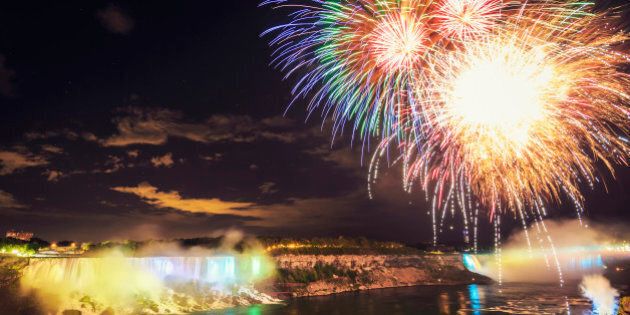 'Colorful Fireworks at illuminated Niagara Falls at Night. Niagara Falls,Canada.'