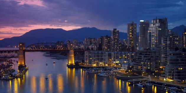 Yaletown and the Burrard Bridge in False Creek in the city of Vancouver, British Columbia in Canada.