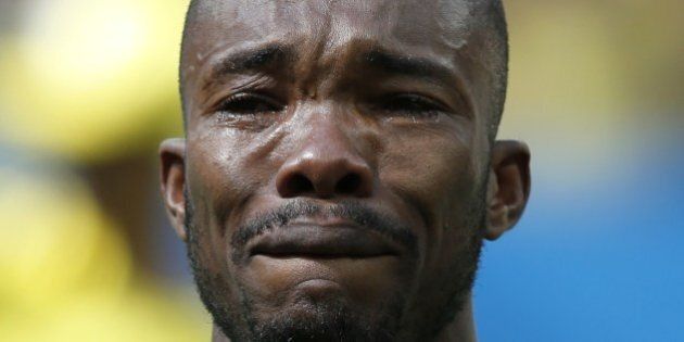 Ivory Coast's midfielder Geoffroy Serey Die cries as he listens to his national anthem before the start of the Group C football match between Colombia and Ivory Coast at the Mane Garrincha National Stadium in Brasilia during the 2014 FIFA World Cup on June 19, 2014. AFP PHOTO / ADRIAN DENNIS (Photo credit should read ADRIAN DENNIS/AFP/Getty Images)