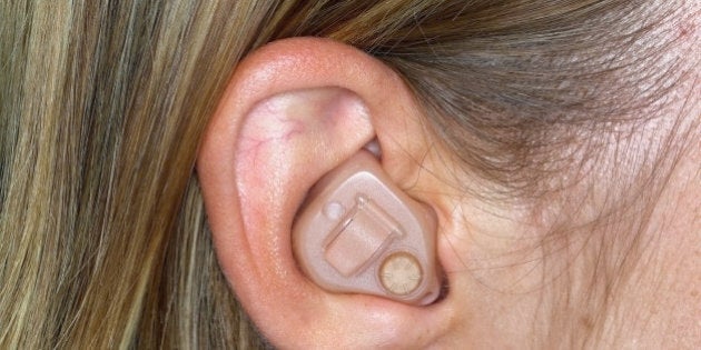 Woman with hearing aid, close up