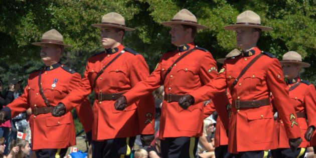 "E" Division's finest in Review Order. What could be more Canadian than a troop of Mounties sweltering in their red serge on Canada Day?
