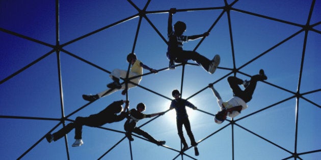 Low angle view of children on a jungle gym