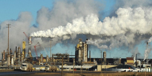 View of the Syncrude oil sands extraction facility near the town of Fort McMurray in Alberta Province, Canada on October 25, 2009. Greenpeace is calling for an end to oil sands mining in the region due to their greenhouse gas emissions and have recently staged sit-ins which briefly halted production at several mines. At an estimated 175 billion barrels, Alberta's oil sands are the second largest oil reserve in the world behind Saudi Arabia, but they were neglected for years, except by local companies, because of high extraction costs. Since 2000, skyrocketing crude oil prices and improved extraction methods have made exploitation more economical, and have lured several multinational oil companies to mine the sands. AFP PHOTO/Mark RALSTON (Photo credit should read MARK RALSTON/AFP/Getty Images)