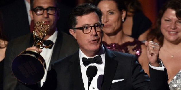 LOS ANGELES, CA - AUGUST 25: TV personality Stephen Colbert accepts Outstanding Variety Series for 'The Colbert Report' onstage at the 66th Annual Primetime Emmy Awards held at Nokia Theatre L.A. Live on August 25, 2014 in Los Angeles, California. (Photo by Kevin Winter/Getty Images)