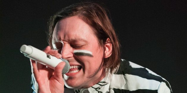 CHICAGO, IL - AUGUST 26: Win Butler of Arcade Fire performs at United Center on August 26, 2014 in Chicago, Illinois. (Photo by Gabriel Grams/Getty Images)