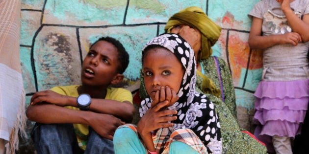 Displaced families who fled fighting in the southern city of Aden wait for relief supplies during a food distribution effort by Yemeni volunteers, in Taiz, Yemen, Saturday, May 9, 2015. Humanitarian organizations say they face challenges delivering aid to citizens affected by the ongoing conflict, because of a severe fuel shortage and difficulty accessing warehouses. (AP Photo/Abdulnasser Alseddik)