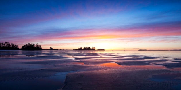 Twilight falls over Chesterman Beach at low tide, Chesterman Beach, Tofino, West Coast Vancouver Island, British Columbia, Canada