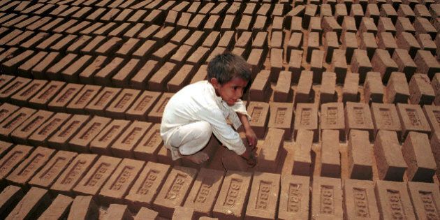 Undated file photo of child labor turning bricks to be baked in sun at Kiln a suburb of Islamabad. About 11 million children are working as child labor in Pakistan. Today, Monday May 28, 2001 Pakistan celebrates the third anniversary of nuke-testing. Pakistani military ruler urges nuclear scientists to expand their research. (AP Photo/B.K. Bangash)