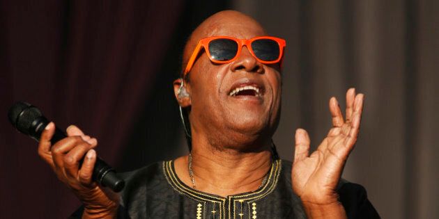 US singer Stevie Wonder performs at the Calling festival, in London, Sunday, June 29, 2014. Thousands of music fans are expected at the weekend's festival to see acts such as Aerosmith and Stevie Wonder. (Photo by Jim Ross/Invision/AP)