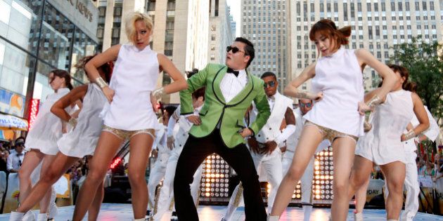 In this photo taken on Sept. 14, 2012, South Korean rapper PSY performs his massive K-pop hit