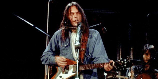 INGLEWOOD, CA - APRIL 1: Canadian musician Neil Young performs with his band The Stray Gators at the Forum on April 1, 1973 in Inglewood, California. (Photo by Michael Ochs Archives/Getty Images)
