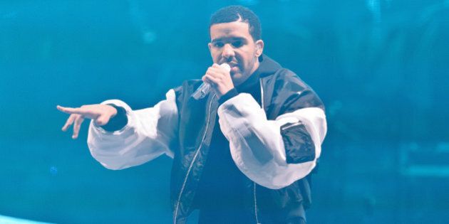 LONDON, UNITED KINGDOM - MARCH 24: Drake performs on stage at O2 Arena on March 24, 2014 in London, United Kingdom. (Photo by Joseph Okpako/Redferns via Getty Images)