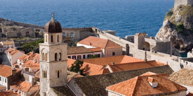 Croatia, Dubrovnik, Franciscan Monastry and rooftops by Adriatic Sea, elevated view