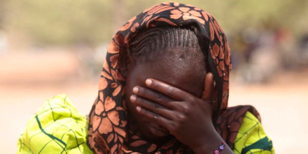 In this photo taken Saturday, Jan. 31, 2015. Dorcas Aiden, 20 years old , speaks to a journalist in Yola, Nigeria. Dorcas Aiden was another of the girls caught in Boko Haramâs siege. She had finished high school and was living at home when the war came to her village. Fighters took her to a house in the town of Gulak and held her captive for two weeks last September. The more than 50 teenage girls crammed into the house were beaten if they refused to study Quranic verses or conduct daily Muslim prayers, she says. When the fighters got angry, they shot their guns in the air. Aiden finally gave in and denied her Christian faith to become Muslim, at least in name, she says. (AP Photo/Lekan Oyekanmi)