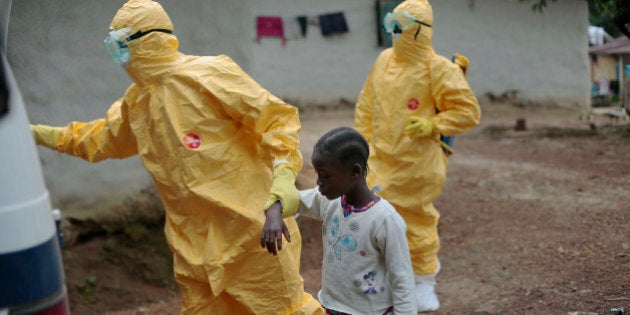 Nowa Paye, 9, is taken to an ambulance after showing signs of Ebola infection in the village of Freeman Reserve, about 30 miles north of Monrovia, Liberia, Tuesday Sept. 30, 2014. Three members of District 13 ambulance service travelled to the village to pickup six suspected Ebola sufferers that had been quarantined Six months into the worldâs worst-ever Ebola outbreak, and the first to happen in an unprepared West Africa, the gap between what has been sent by other countries and private groups and what is desperately needed is huge. Even as countries try to marshal more resources to close the gap, those needs threaten to become much greater, and possibly even insurmountable. (AP Photo/Jerome Delay)