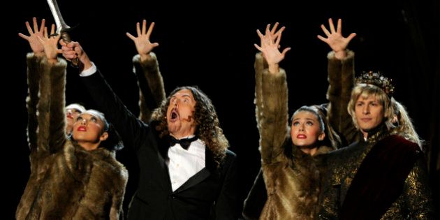 Weird Al Yankovic, left, and Andy Samberg perform on stage at the 66th Annual Primetime Emmy Awards at the Nokia Theatre L.A. Live on Monday, Aug. 25, 2014, in Los Angeles. (Photo by Chris Pizzello/Invision/AP)