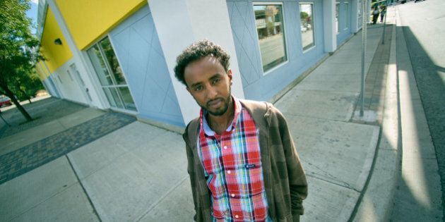 09/14/10 - TORONTO, ONTARIO - Nahom Berhane, of the centre, stands outside the colorful building. Access Point on Danforth is a centre which brings together a number of services from health care to youth programs, and greatly serves newcomers to Canada. (Photo by Rick Madonik/Toronto Star via Getty Images)