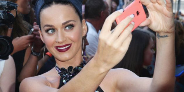 SYDNEY, AUSTRALIA - NOVEMBER 26: Katy Perry poses with fans at the 28th Annual ARIA Awards 2014 at the Star on November 26, 2014 in Sydney, Australia. (Photo by Don Arnold/WireImage)