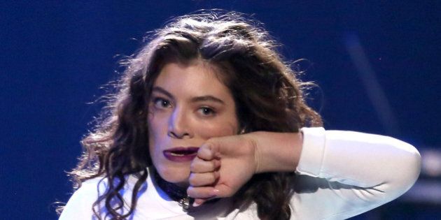 Lorde performs at the 42nd annual American Music Awards at Nokia Theatre L.A. Live on Sunday, Nov. 23, 2014, in Los Angeles. (Photo by Matt Sayles/Invision/AP)