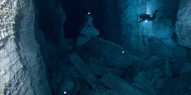 URAL, RUSSIA - UNDATED: EXCLUSIVE Cave divers from the Orda Cave Awareness Project explore the beautifully transparent Orda Cave in Russia's western Urals region. A team of daring cave divers have produced an incredible photo-reportage of the longest underwater gypsum cave in the world. Gypsum is a mineral that can form into clear crystals and is responsible for the amazingly transparent mineral water and eye-popping natures of the gullies and rock formations. The Orda Cave in Russia's western Urals region is three miles of eerily dramatic natural channels created by water so clear divers can see over 50 yards into the deep. Over a period of six months the intrepid team led by underwater photographer and journalist, Victor Lyagushkin, 40, from Russia explored the water filled cave tunnels at temperatures barely above freezing. Together the divers documented their journey into Orda Cave as part of a project to raise awareness of the beauty and fragility of this little explored natural wonder. Even air bubbles can damage the ceiling of the cave - which meant Victor's team had to construct an underwater funnel to take their air bubbles safely to the mouth of the cave. In France Gypsum was commonly ground up and used as plaster in construction - which is where the name 'plaster of Paris' is thought to have come from. (Photo by Victor Lyagushk / Barcroft Media / Getty Images)