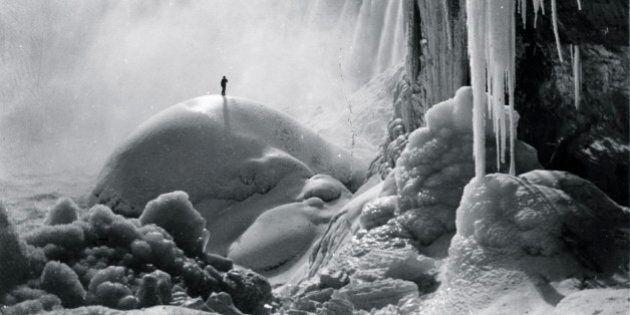 UNSPECIFIED - CIRCA 1903: Sole Adventurer stand on an ice dome beneath the icicled Niagara Falls in a Frozen Wonderland (Photo by Buyenlarge/Getty Images)