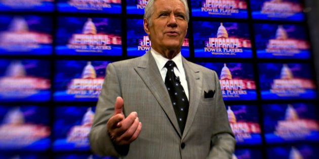 WASHINGTON, DC - APRIL 21: Alex Trebek poses on the set of his game show Jeopardy on April 21, 2012. Mr. Trebek was in Washington for his 'Jeopardy! Power Players Week' shows which were being filmed inside DAR Constitution Hall. (Photo by Tracy A. Woodward/The Washington Post via Getty Images)