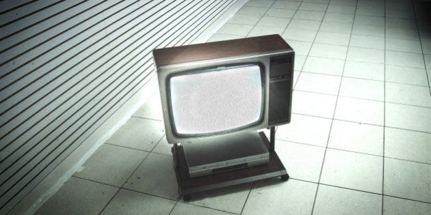 A minimalistic photo of a Television set from the 1980s